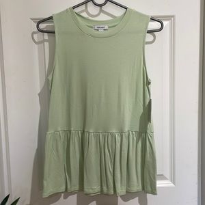 Nine west woman’s sleeveless top. Size Small. The color is a mint green.